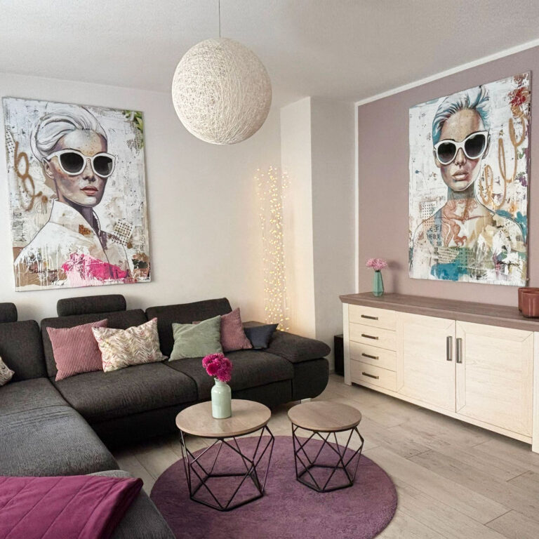 Two pop-art portraits of women wearing sunglasses in the living room